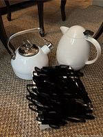 Chantal stovetop kettle alongside white electric kettle