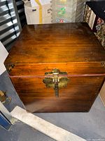Full view of wood trunk front with brass hardware