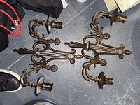 Both metal sconces showing overall design and bulb sockets