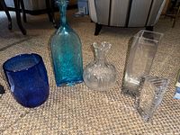 Group shot of all five vases showing size and color variations