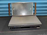 Full view of Sony combo player with warming tray on top