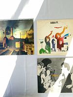 Three record jackets laid out