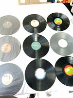 Overall view of nine vinyl records arranged on table