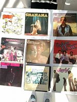 Nine LP records arranged in 3x3 grid showing all cover fronts