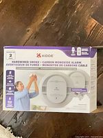 Front of retail box showing Kidde hardwired smoke & carbon monoxide alarm packaging