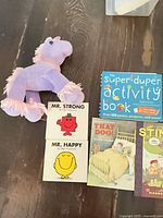 Plush unicorn, Super Duper Activity Book, Mr. Strong, Mr. Happy, That Dog!, Stinky