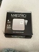 Front of sealed Stelpro Maestro thermostat retail box
