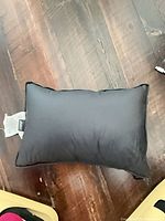 Front view of black MEC camping pillow