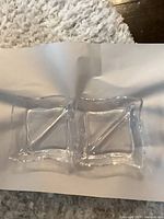 Top view of both glass dishes showing two-compartment design