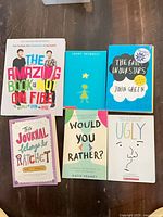 Front covers of all six books laid out