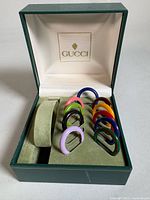 Open Gucci box showing all ten coloured bezel rings