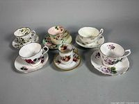All six bone china teacup and saucer sets arranged together