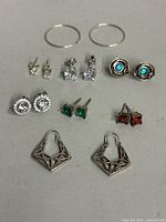 Group view of all eight pairs of sterling silver earrings