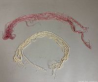 Top view of all pink and white pearl strands
