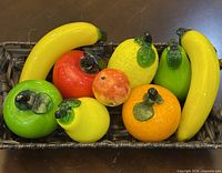 Group shot of all nine fruit pieces in basket