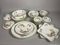 Entire set of Glamis Thistle dinnerware showing platters, bowl, plates, lids