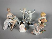 Group shot of all six porcelain figurines
