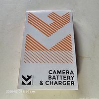 Front of sealed retail box showing K&F Concept branding and Camera Battery & Charger text