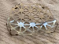 Top view showing geometric cut-out pattern and shape