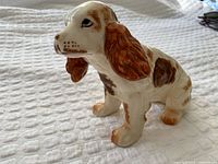 Full side view of porcelain spaniel figurine