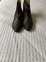 Front view of both ankle boots side by side