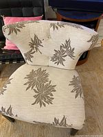Front view of accent chair showing overall upholstery and legs
