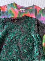 Two tops laid out showing patterns and materials