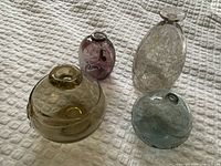 All four handblown glass vases grouped together