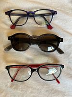 Three pairs of eyewear laid out showing overall style and colors