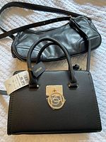 Both handbags side by side showing overall design and bebe tag