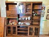 Front view of full hutch showing shelves, glass cabinets, drop-front compartment