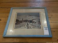 Full view of framed lithograph with blue frame and MaxSold lot tag