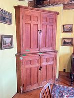 Full view of two-piece corner cupboard hutch
