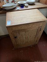 Front view of cabinet showing door and latch