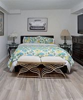 Full view of assembled queen bed frame with headboard, side rails, footboard