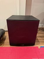 Front view of Polk Audio PSW108 powered subwoofer with grille attached