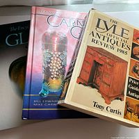 Stack of three hardcover collector books