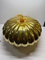 Top view of gold mercury glass pumpkin showing ribbed body and reflective finish