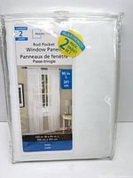 Front of sealed Mainstays 2-panel package showing product name, size and image of curtains