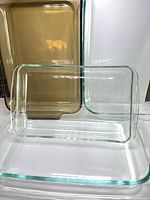 All four rectangular glass dishes grouped, showing color and shape