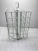 Metal rotating craft paint organizer showing wire construction, top handle, and spinning base