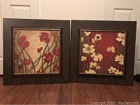 Two square framed flower wall art pieces set side by side, each 27x27 inches, showing floral designs with red and cream colored flowers