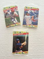 Front view of the three sealed packs showing cover players