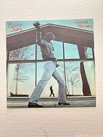 Front cover of Billy Joel Glass Houses LP showing artwork and condition
