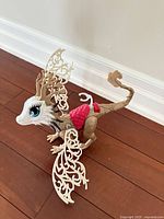 Side profile of Braebyrn dragon showing wings, saddle and facial detail