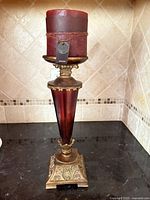 Full view of candle on holder showing overall design and height