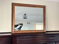 Front view of rectangular mirror with copper/bronze frame and gold inner liner