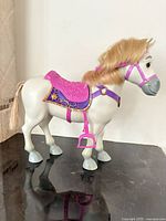 Left side view of Maximus horse showing saddle and bridle