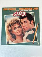 Front cover showing John Travolta and Olivia Newton-John portrait, title and artists
