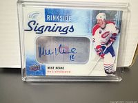 Front view of encased Mike Keane Rinkside Signings card with autograph visible